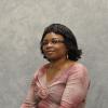 A photo of the faculty member against a gray background.